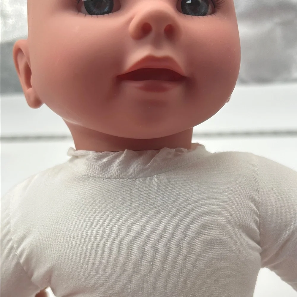 Realistic Baby Doll with White Outfit